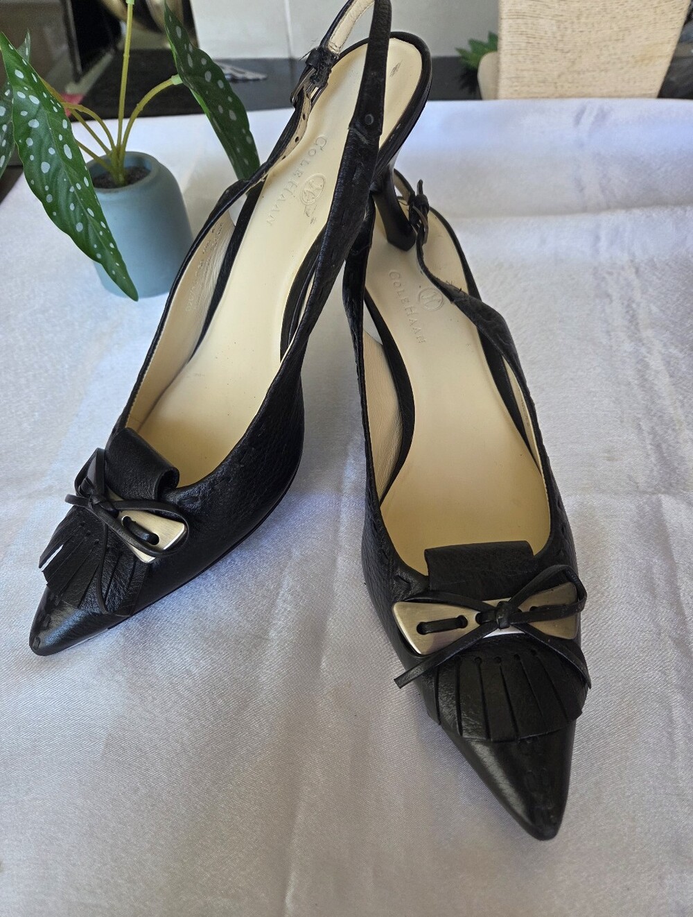 Cole Haan Black Pointed Slingback Heels with Metallic Bow Accent